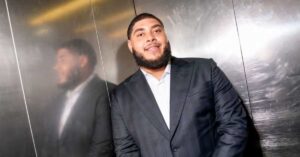 Portrait of Big Zuu in an elevator showing his fashion style