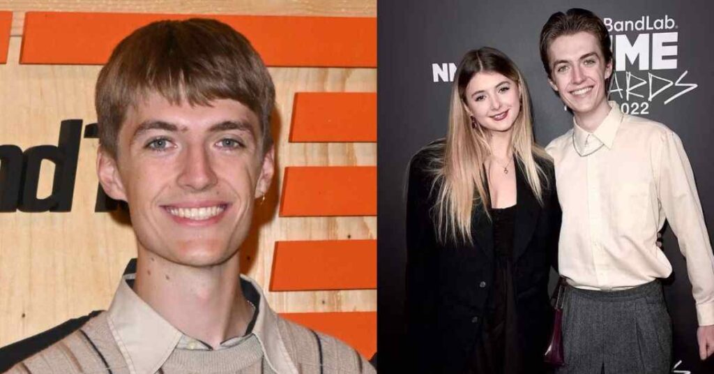 Francis Bourgeois posing with a lady at a media event, showcasing his public appearances.