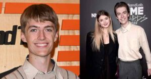 Francis Bourgeois posing with a lady at a media event, showcasing his public appearances.