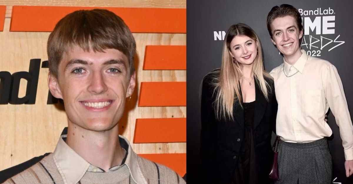 Francis Bourgeois posing with a lady at a media event, showcasing his public appearances.