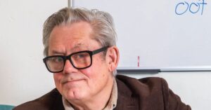 Graham Fellows performing on stage as John Shuttleworth, British actor, musician, and comedy entertainer.