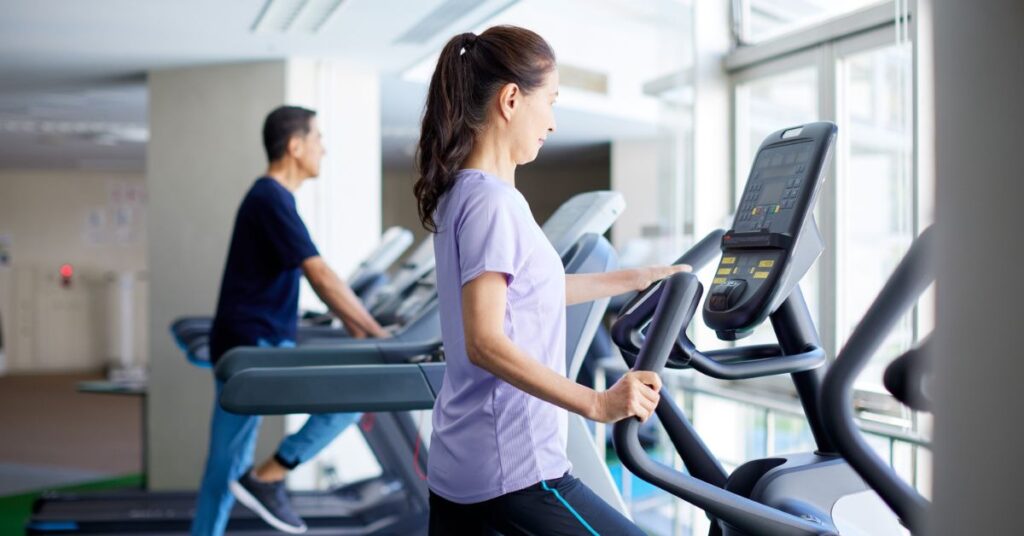 Person following a daily health routine during gym workout