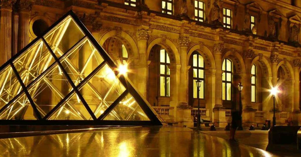 "Montmartre neighborhood at night with soft lights and artists on the streets"