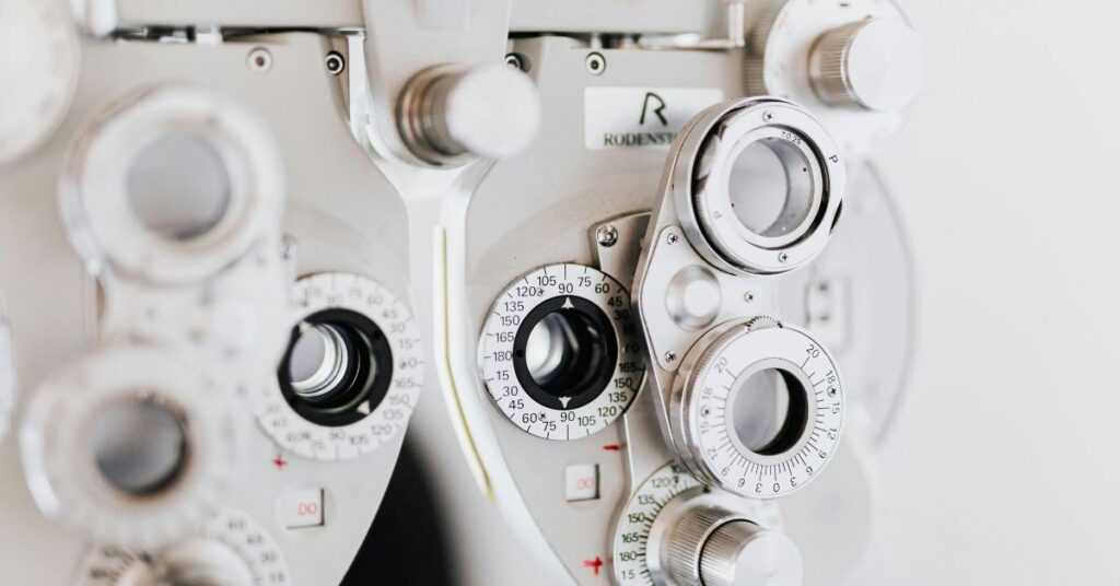 Close-up view of an optometry phoropter used for eye testing and vision correction assessment.